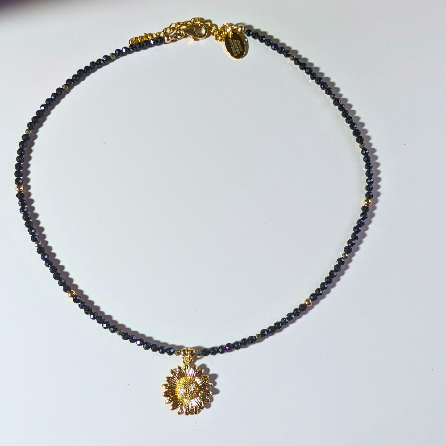 Gilded Blooms: Gold Filled Sunflower Pendant Necklace with Black Spinel