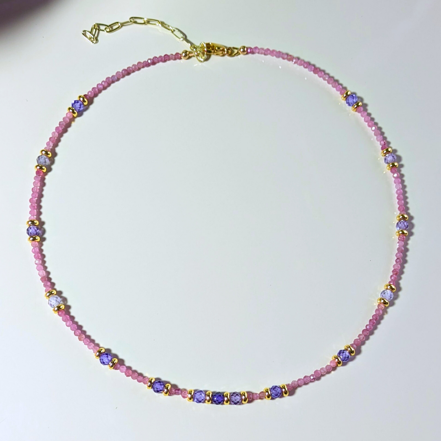 Ethereal Fusion: Faceted Rhodonite and Purple Zirconia Necklace with Stainless Steel Elegance