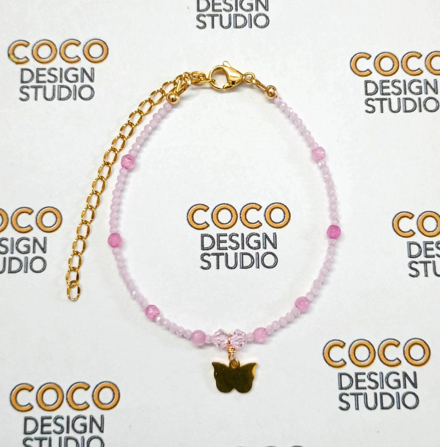 Whimsical Flutter Bracelet: Faceted Pink Zirconia, Pink Jade, Swarovski Crystals, and Butterfly Charm